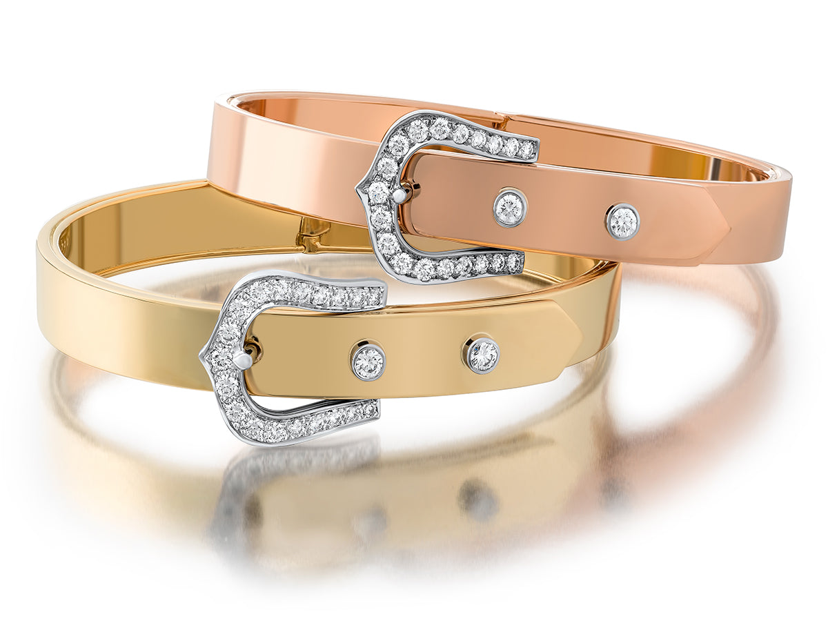 Yellow and pink gold buckle-motif bracelets with diamonds on a white background.