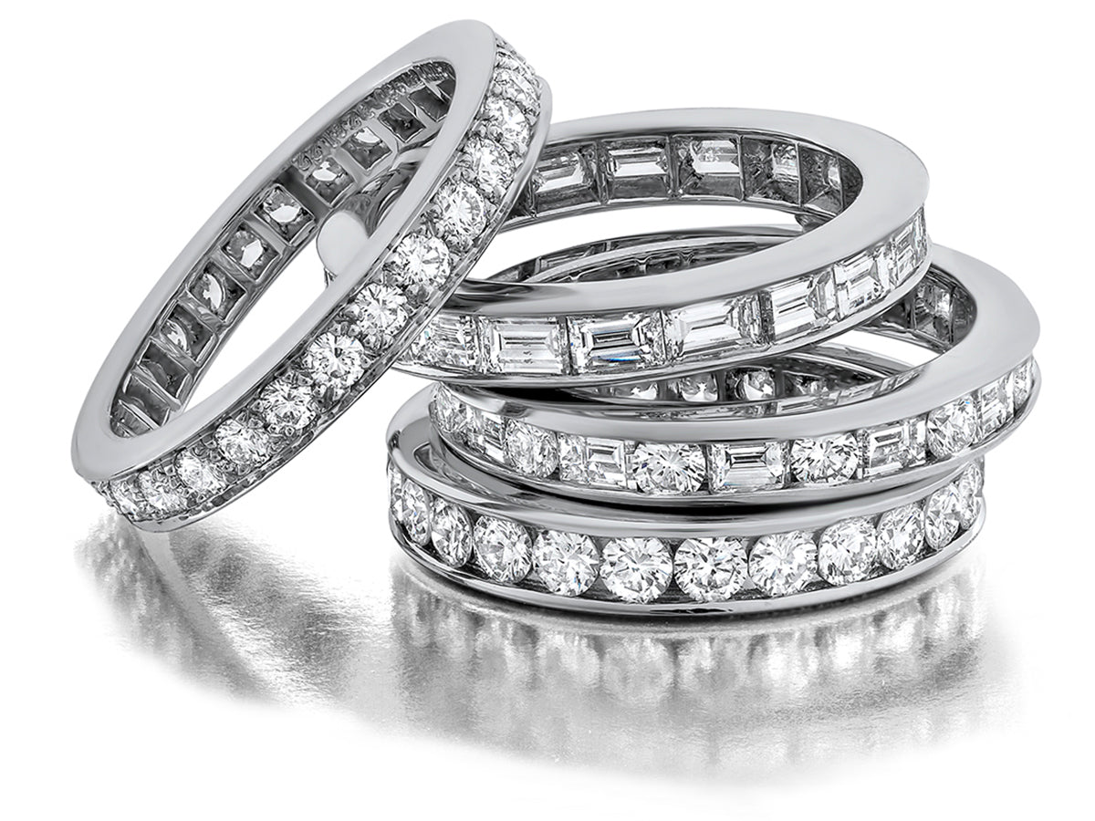 Diamond wedding bands on white background