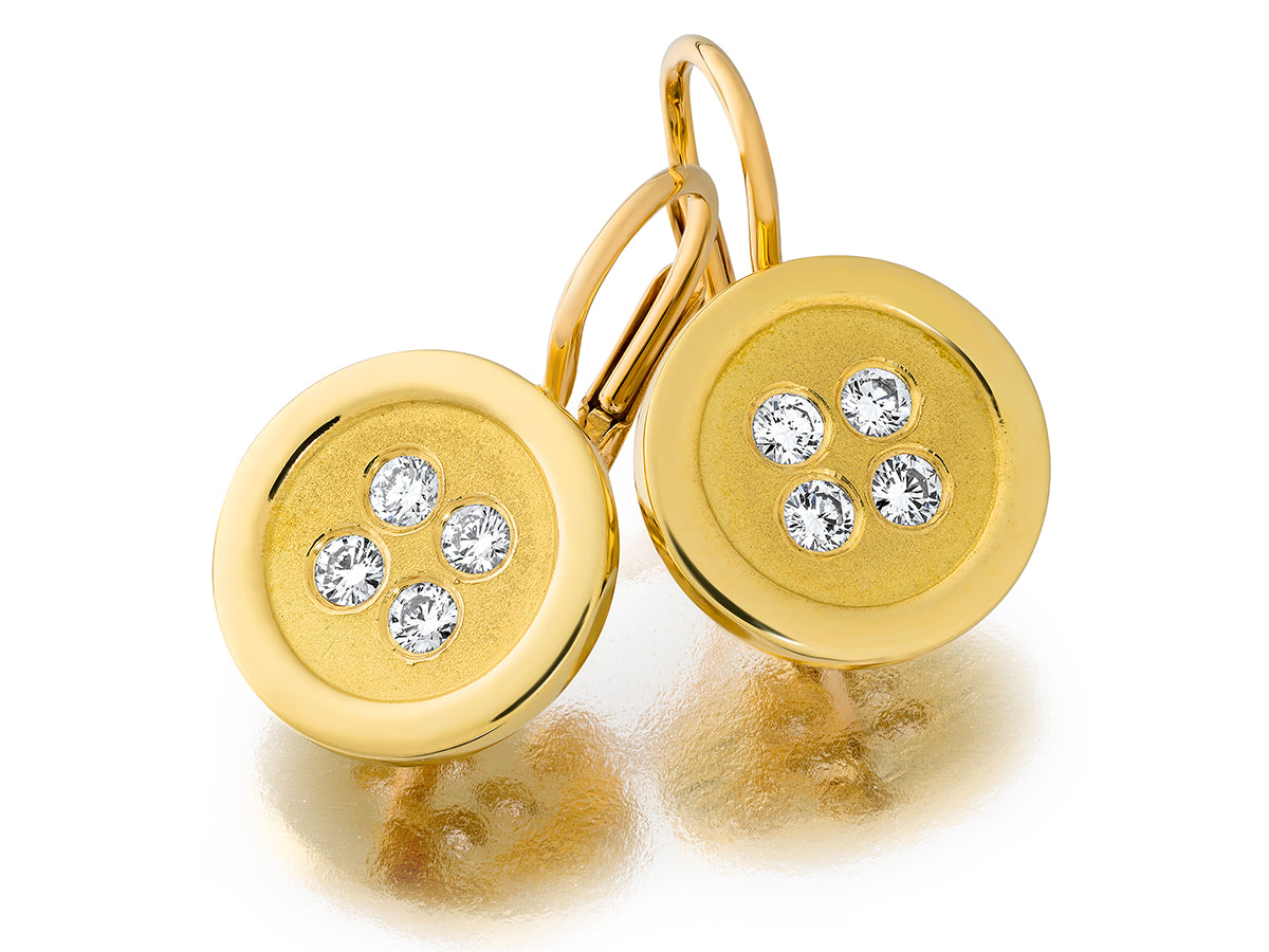 Gold earrings with diamonds on a white background