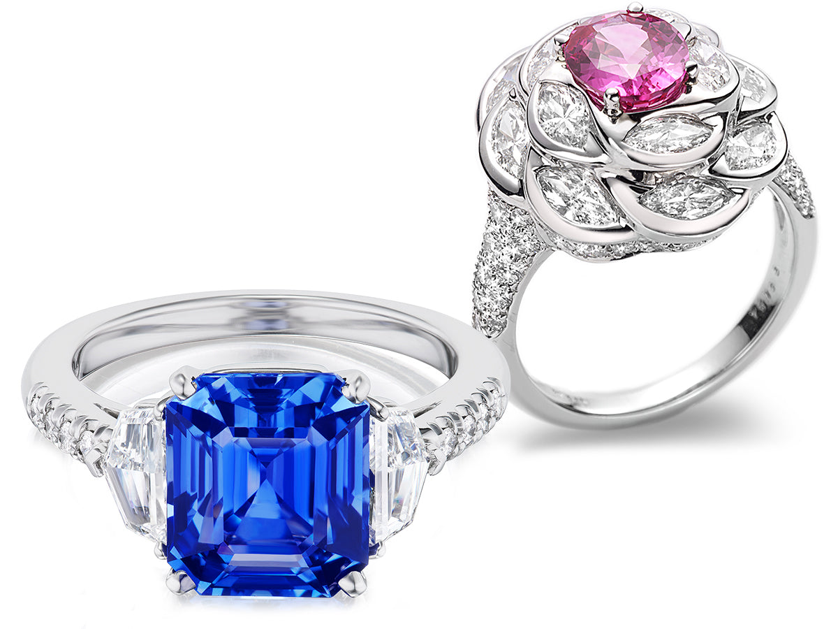 Two rings with blue and pink gemstones on a white background