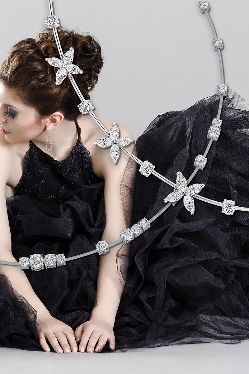 Woman in elegant black dress with diamond necklaces