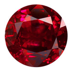 Round red gemstone on a white background