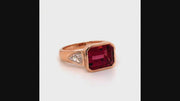 Video of rotating ring with reddish pink gemstone and diamonds on white background