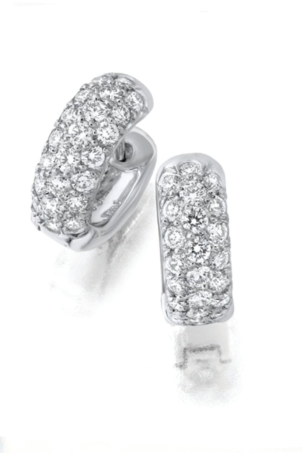 18K white gold and diamond huggie earrings on a white background