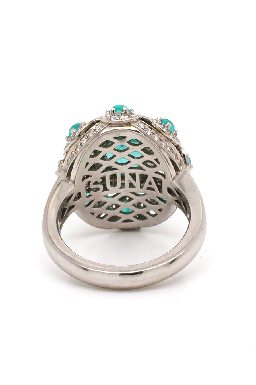 Back view of platinum ring with a faceted African paraiba, Brazilian cabochon paraibas, and diamonds on a white background