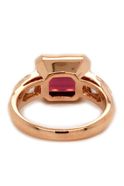 Back view of 20K pink gold ring with a rubellite and diamonds on white background.