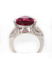 Back view of 18K white gold ring featuring a large trilliant cut rubellite with diamonds on a white background