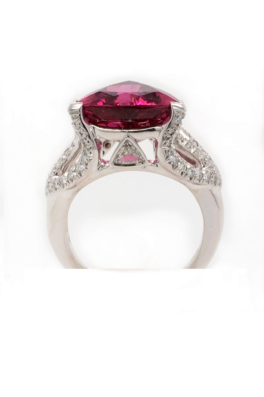 Back view of 18K white gold ring featuring a large trilliant cut rubellite with diamonds on a white background