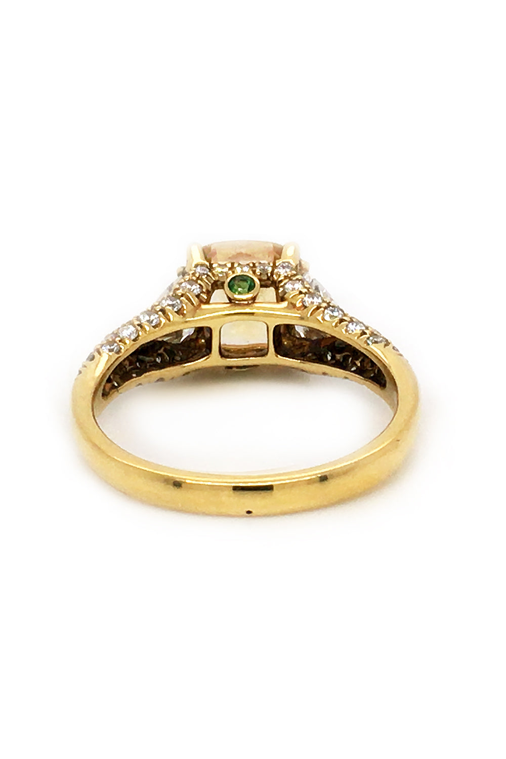 Back view of 18K yellow gold ring with a yellow sapphire, trilliant diamonds, and pavé diamonds on white background.