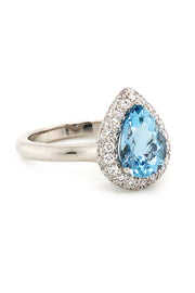 Platinum ring with aquamarine and  diamonds on white background