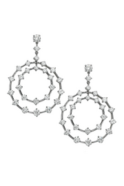 Platinum and diamond earrings featuring a circle design on a white background