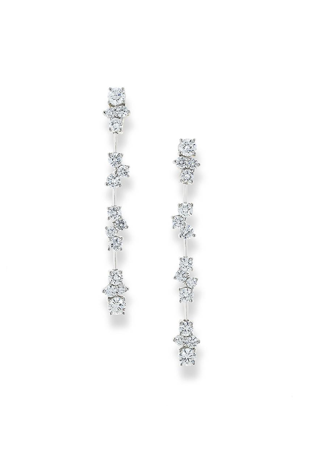 Platinum drop earrings featuring multiple segments with diamond clusters on a white background,.
