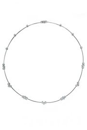 Platinum necklace with diamond clusters on platinum wire with a floating effect on a white background