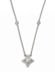 Platinum pendant with a lace design and diamonds on a white background