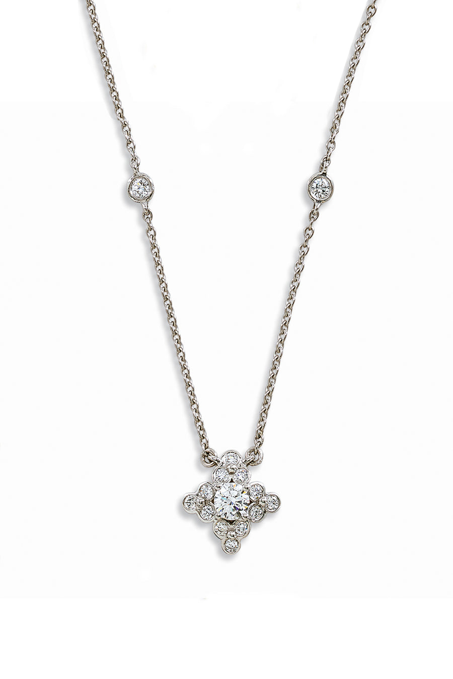 Platinum pendant with a lace design and diamonds on a white background