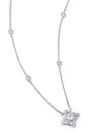 Platinum pendant with a lace design and diamonds on a white background