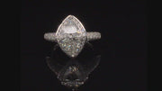 Video of rotating ring with diamonds on black background