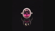 Video of rotating 18K white gold ring with large oval rubellite and diamonds on black background