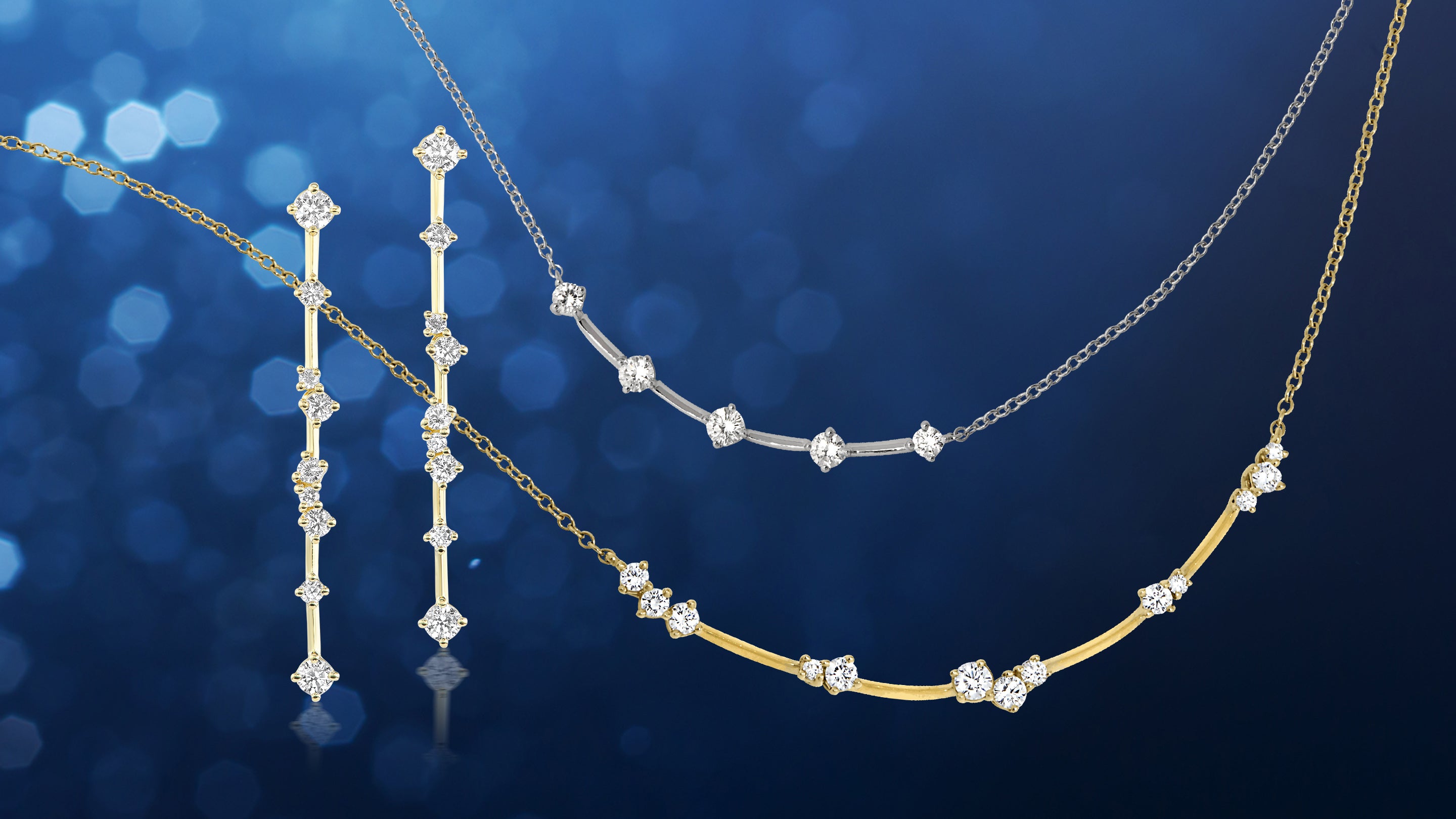 White and yellow gold necklaces and earrings with diamond accents on a blue background