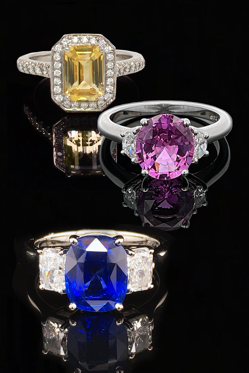 Three sapphire rings on black background