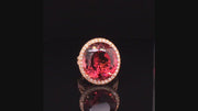 Video of rotating 20K pink gold ring with large oval cinnamon tourmaline and diamonds on black background