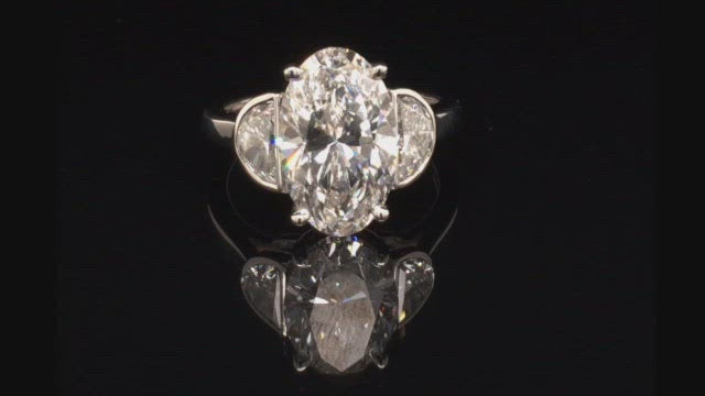 Video of rotating ring with diamonds on black background