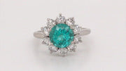 Video of rotating platinum ring with paraiba surrounded by diamonds on white background