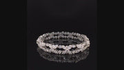 Video of rotating bracelet with diamonds on black background