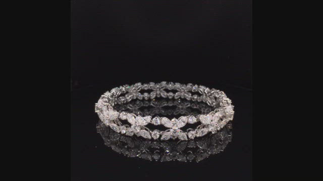 Video of rotating bracelet with diamonds on black background