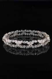 Platinum bracelet with marquise and brilliant diamonds on a black background.