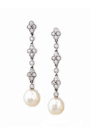 Platinum and diamond lace earrings with South Sea cultured pearls on white background