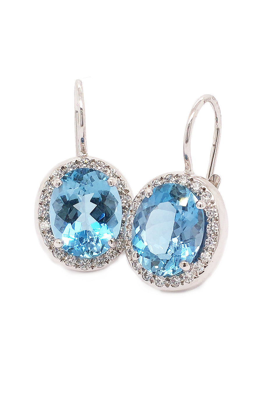 18K white gold earrings featuring large oval aquamarines surrounded with diamonds with lever backs on a white background