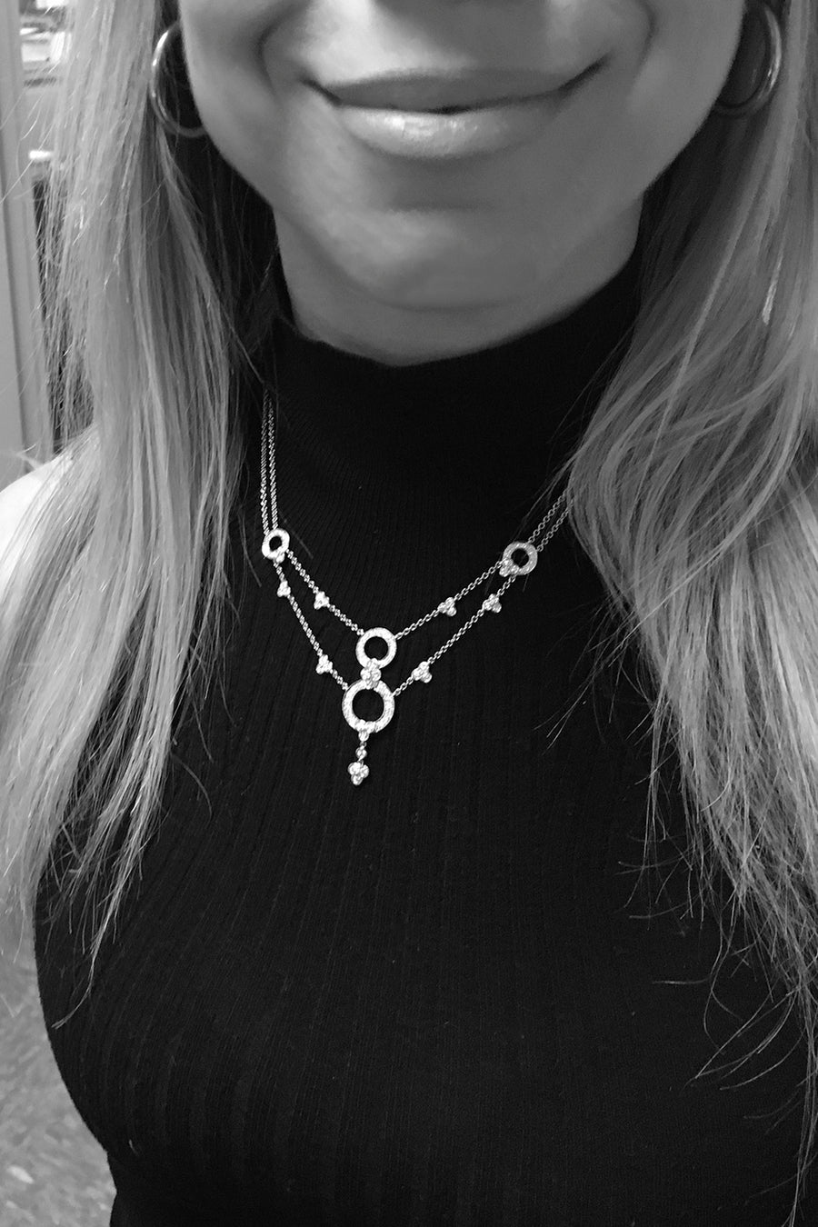 Closeup of woman's neck wearing lace necklace