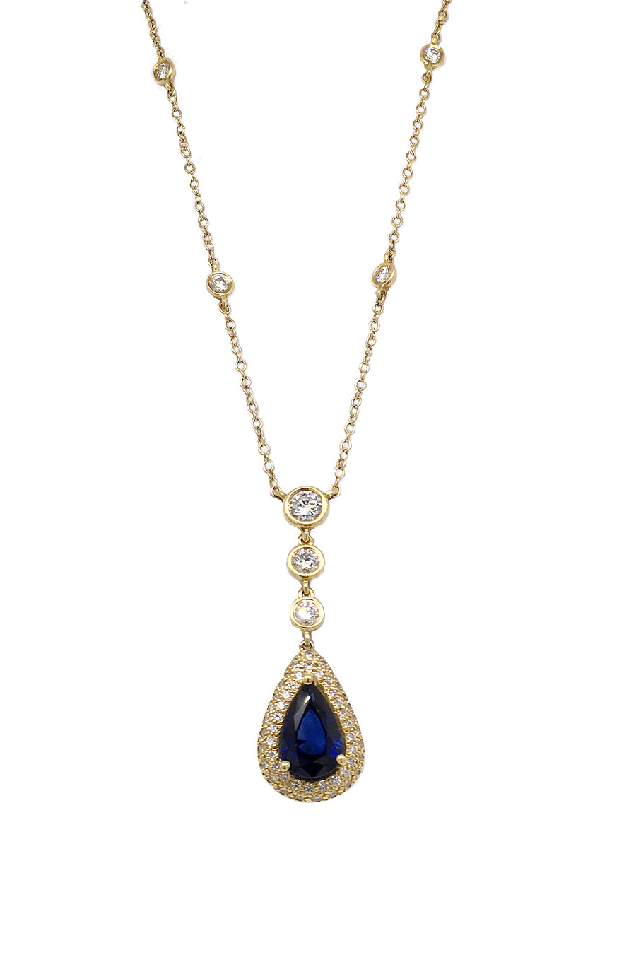 Blue sapphire necklace set in 18K yellow gold with diamonds on white background