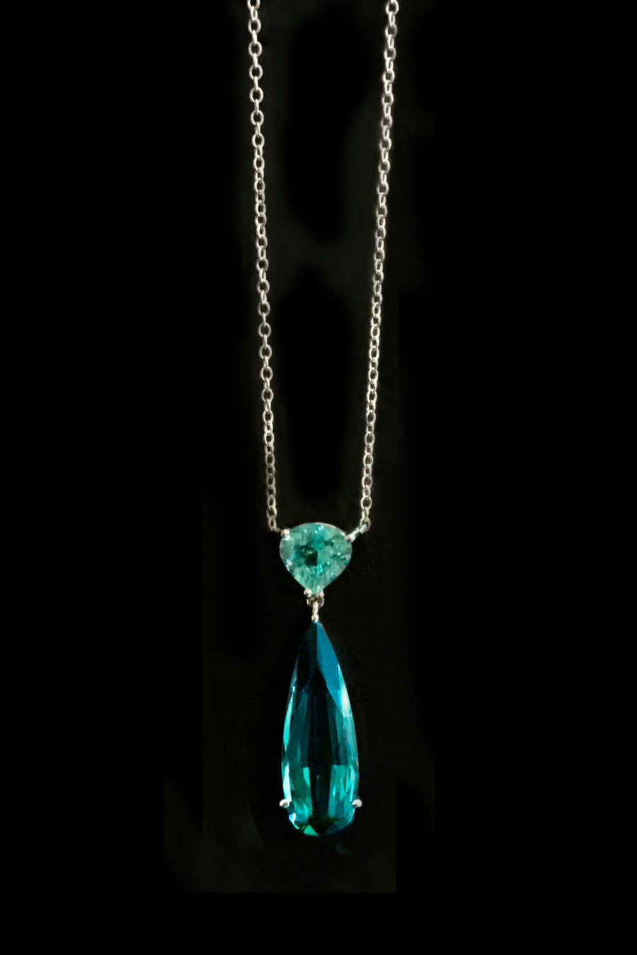 Necklace with indicolite and paraiba tourmaline with diamonds on black background