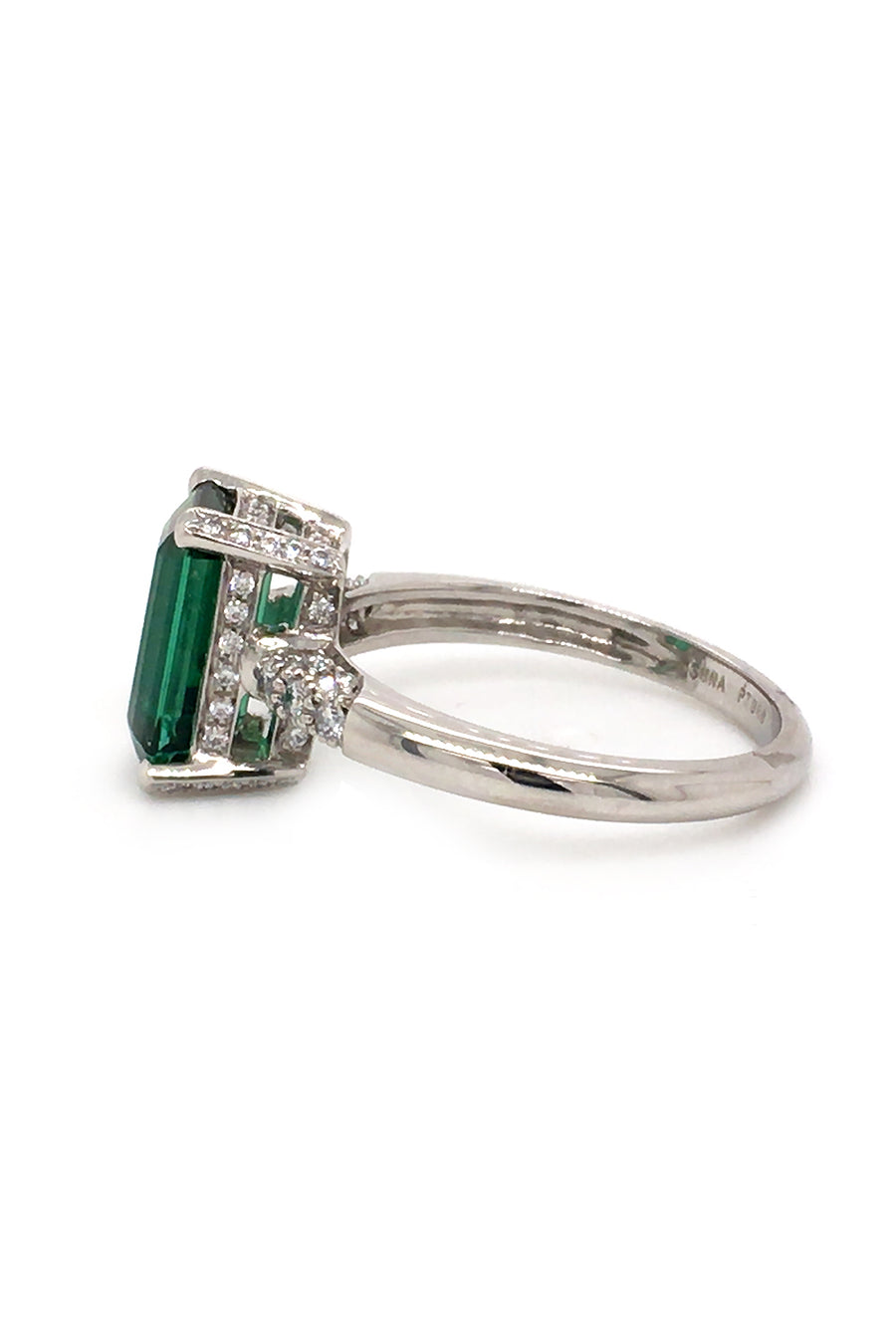 Side view of platinum ring with emerald-cut tourmaline and diamonds on white background