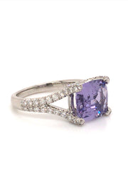Angle view of 18K white gold ring with lavender sapphire and diamonds on white background