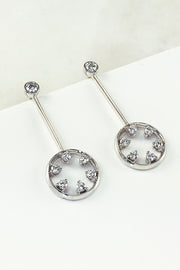 18K white gold and diamond drop earrings featuring circle motif on a white background