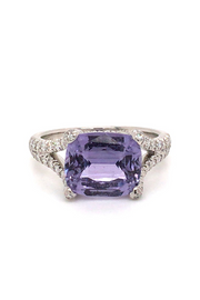18K white gold ring with a lavender sapphire and diamonds on a white background