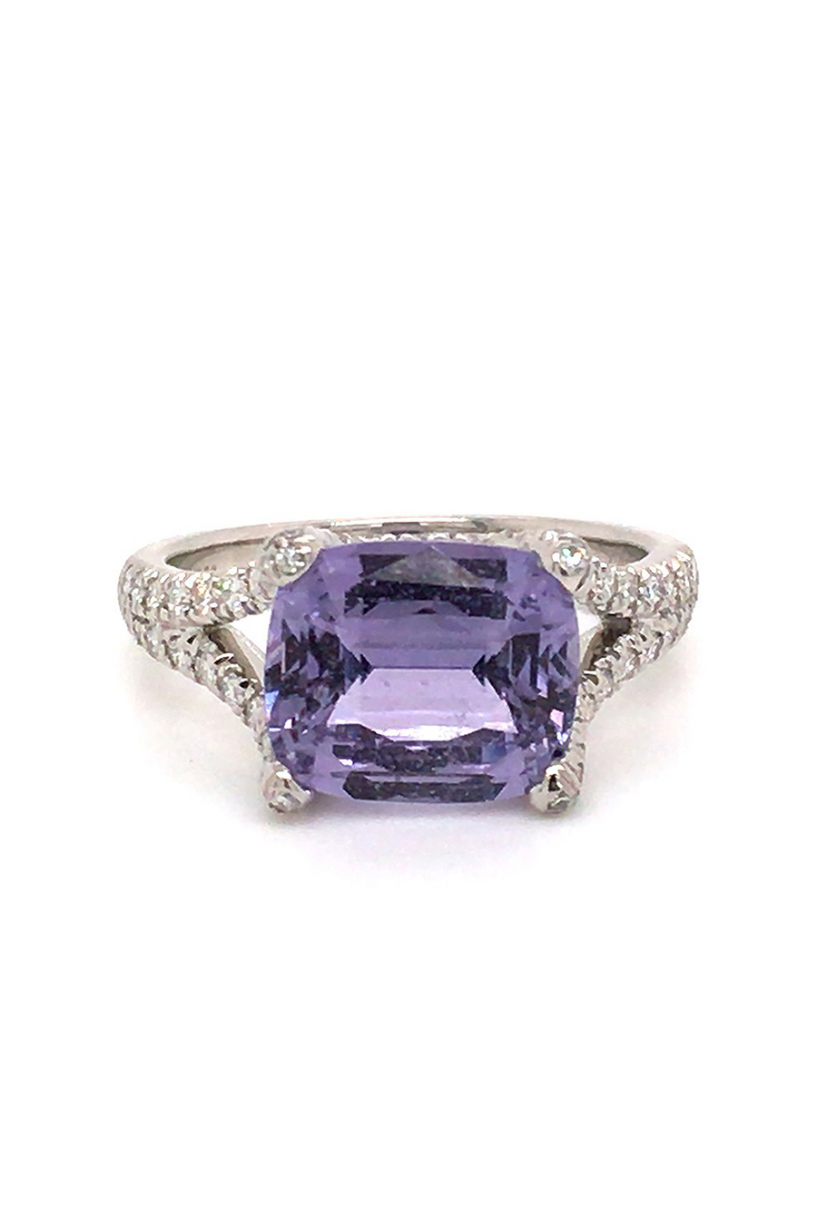 18K white gold ring with a lavender sapphire and diamonds on a white background